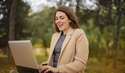 women on laptop taking steps to protect from fraud this fall